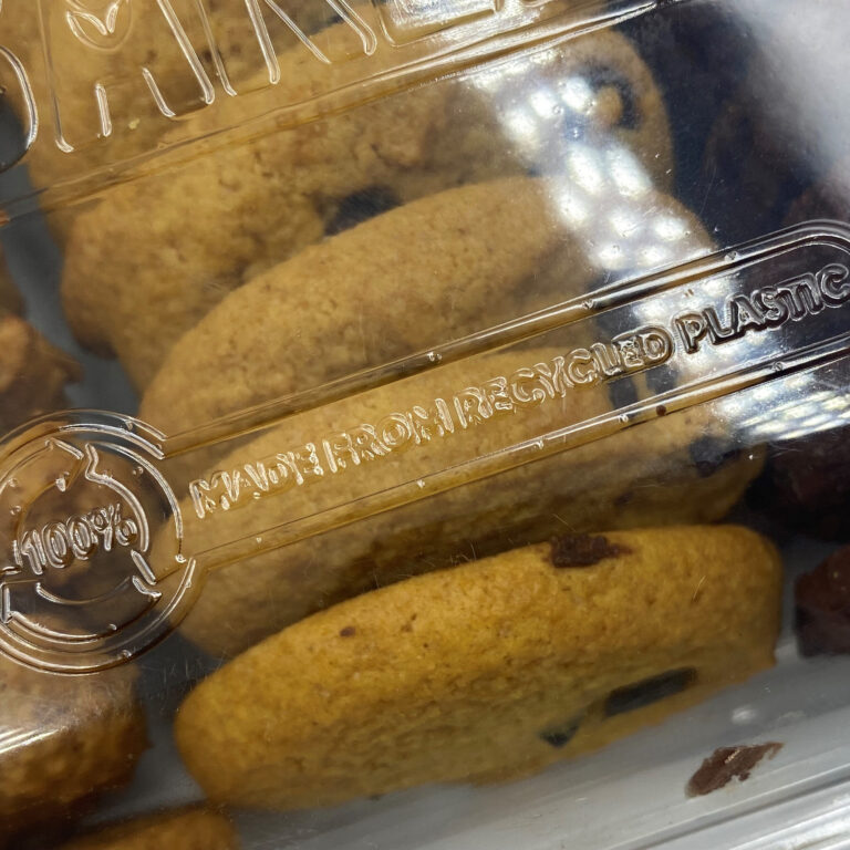 Photo of biscuits or cookies in a clear plastic PET container made from sustainable packaging
